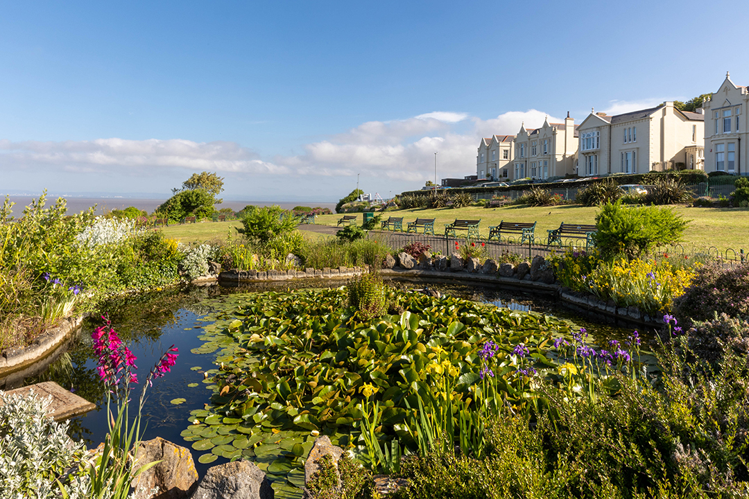View of gardens with a pond in foreground